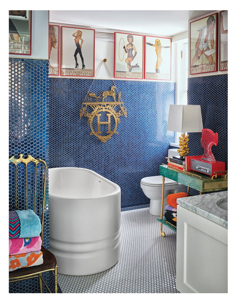 jonathan adler bathroom with a small custom freestanding bath and mosaic tiles